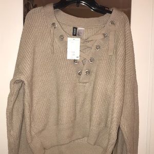 Cropped Lace Up Sweater from H&M, Brand is Divided